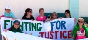 now fighting for justice banner